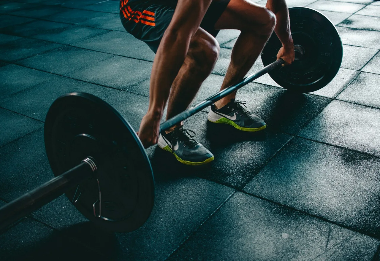 Loaded barbell on a gym floor